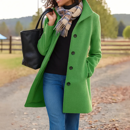 Bright green button-front longline winter coat worn with jeans