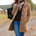 Camel button-front longline winter coat worn with jeans