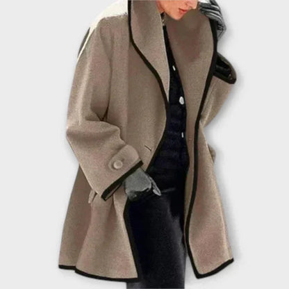 Taupe tailored coat with a shawl collar and black trim