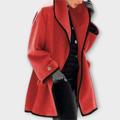 Red tailored coat with a shawl collar and black trim