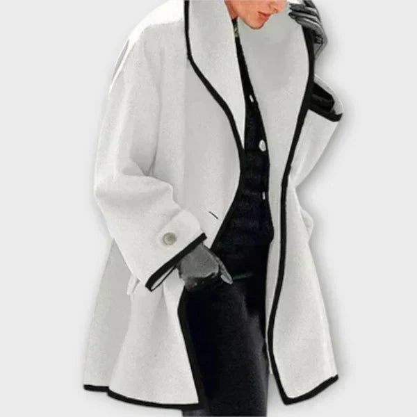 White tailored coat with a shawl collar and black trim