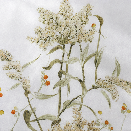 Close-up of the botanical print on white satin
