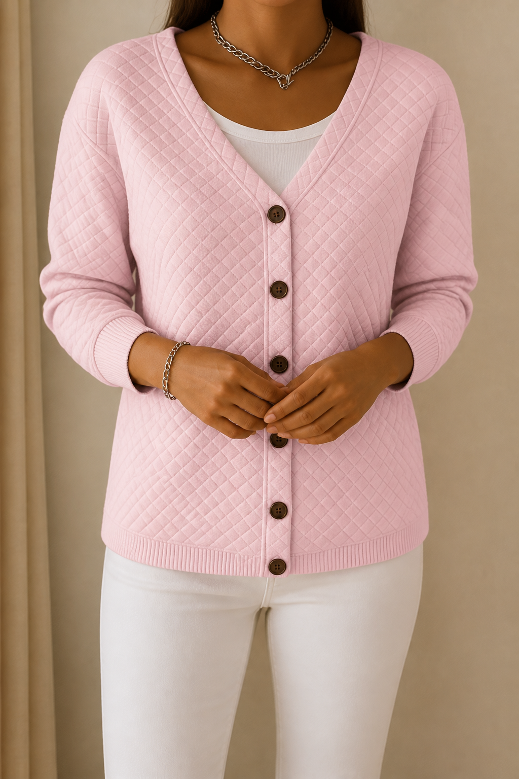 Pink diamond quilted button front cardigan with a V neck