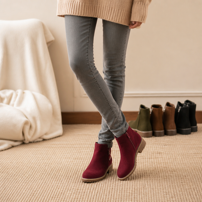 Burgundy suede ankle boots with block heels worn with grey jeans