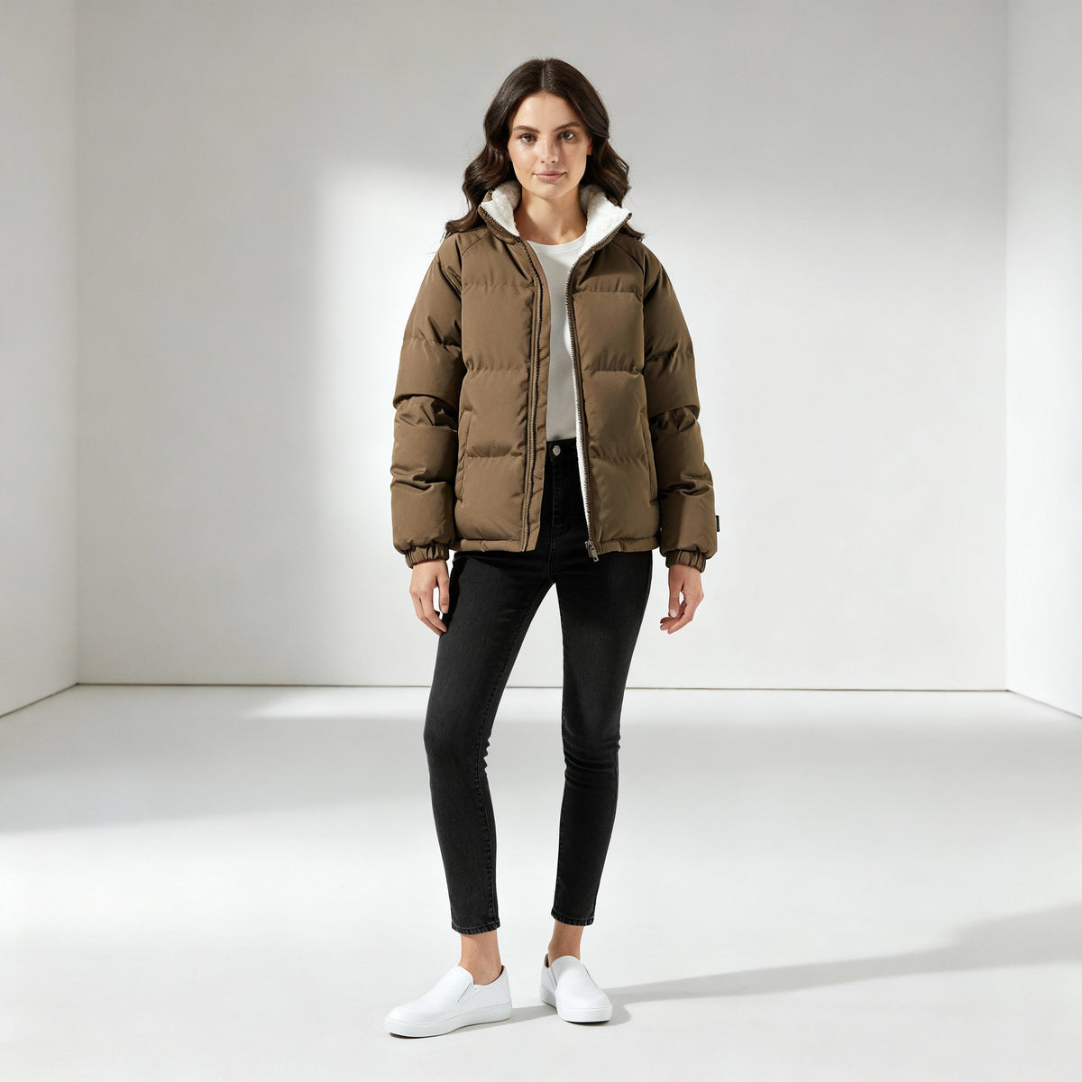 Full length view of the taupe puffer jacket with black jeans