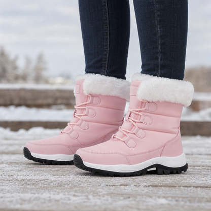Pink snow boots with white faux fur cuffs and lace fronts