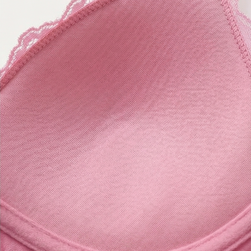 Close-up of the satin cup lining on a pink cami