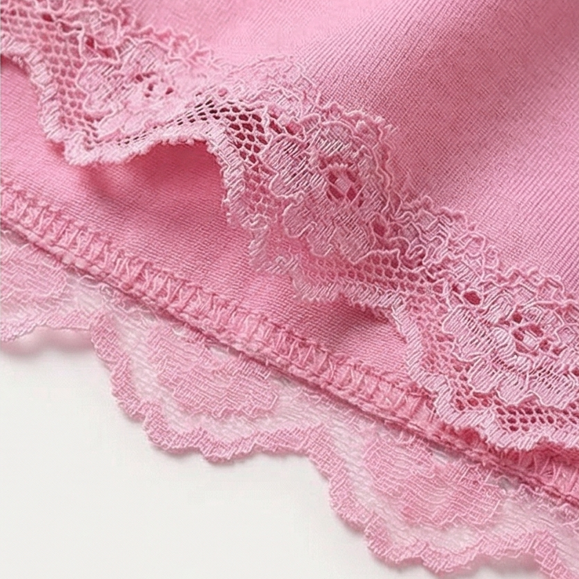 Scalloped lace hem on pink satin shorts