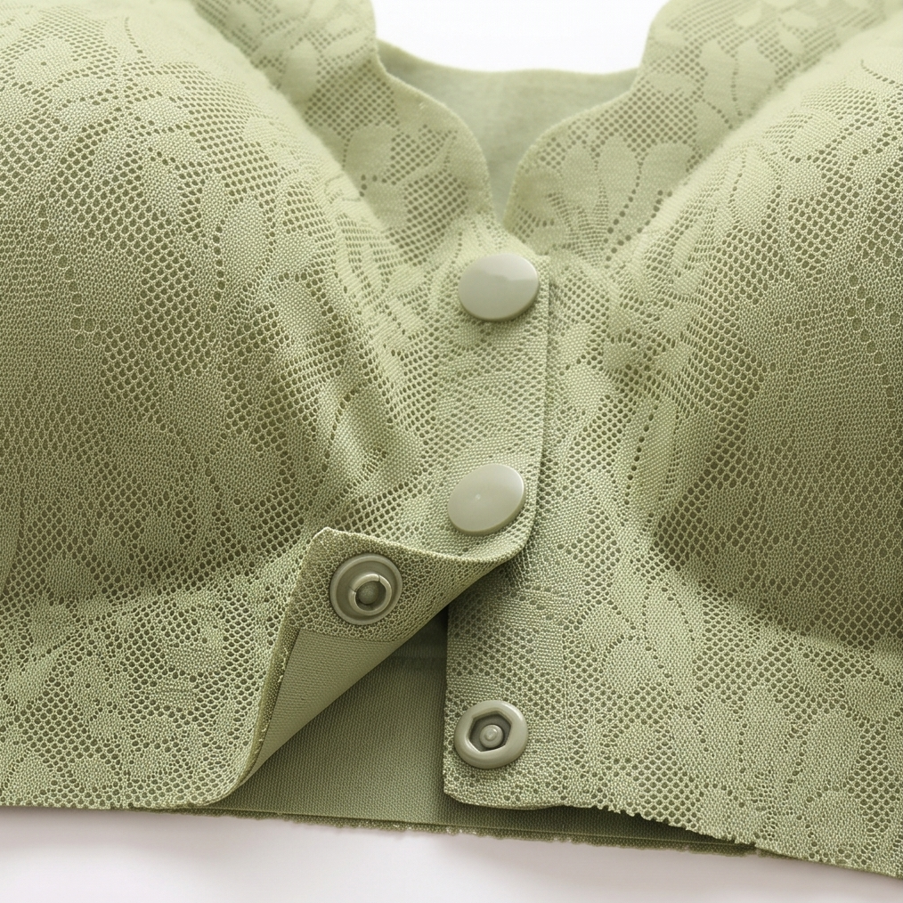 Close-up of the front snap buttons on sage lace