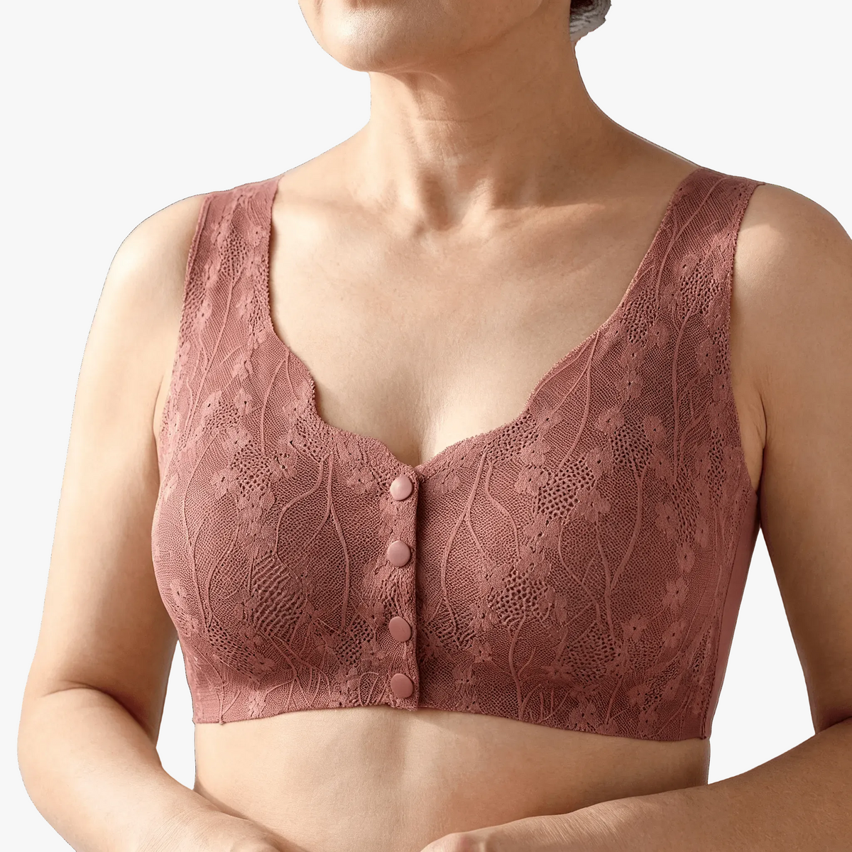 Dusty rose lace front-snap bra worn on a body