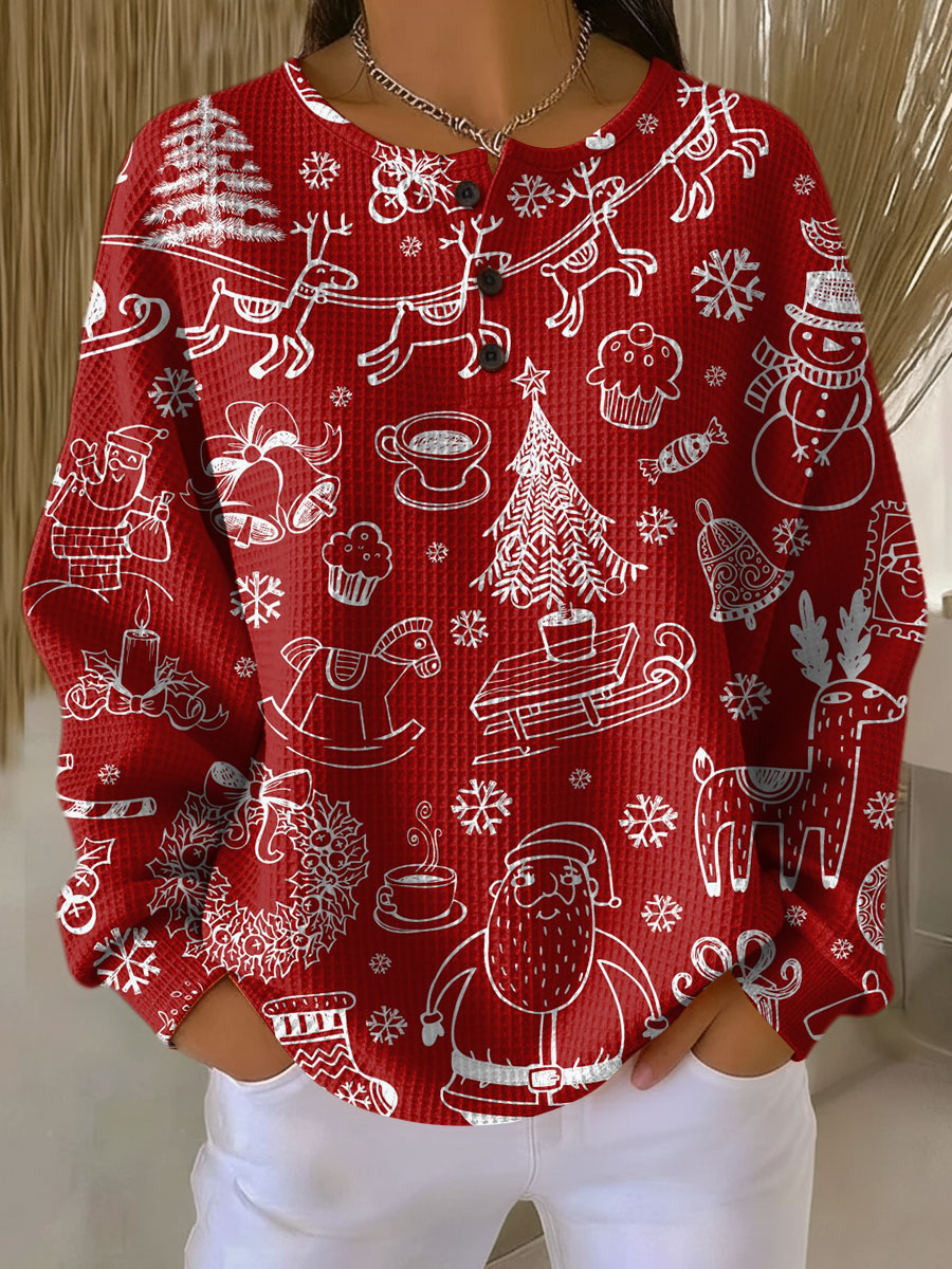 Red waffle knit sweater with a white line drawn holiday doodle print