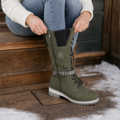 Olive knit cuff tall winter boot on a snowy doorstep
