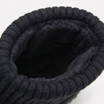 Fleece lined interior of a black knit cuff suede bootie