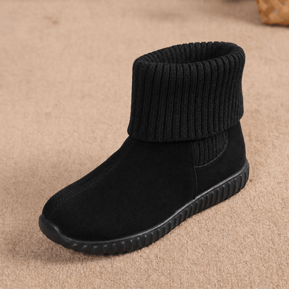 Black suede ankle booties with a folded ribbed knit cuff