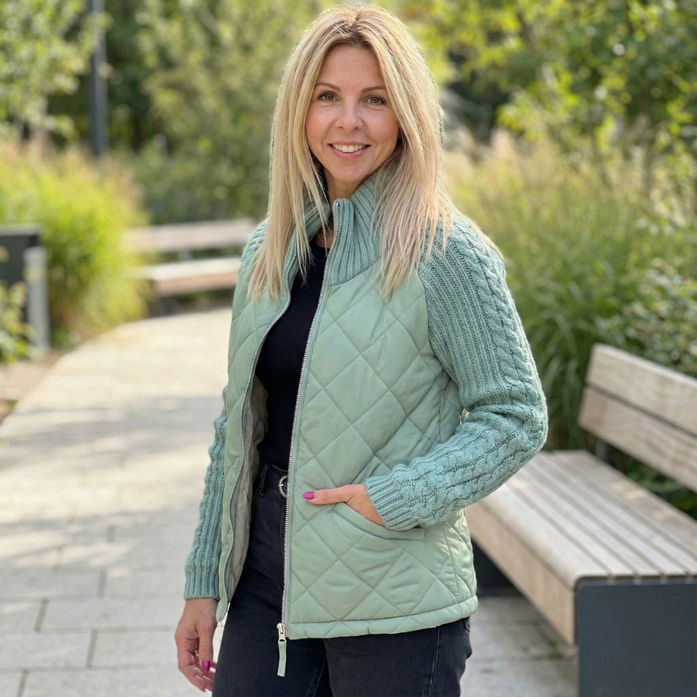 Sage green quilted puffer jacket with cable knit sleeves