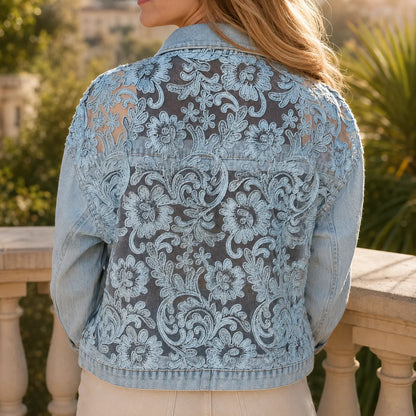 Back view of a denim jacket with a large floral lace panel