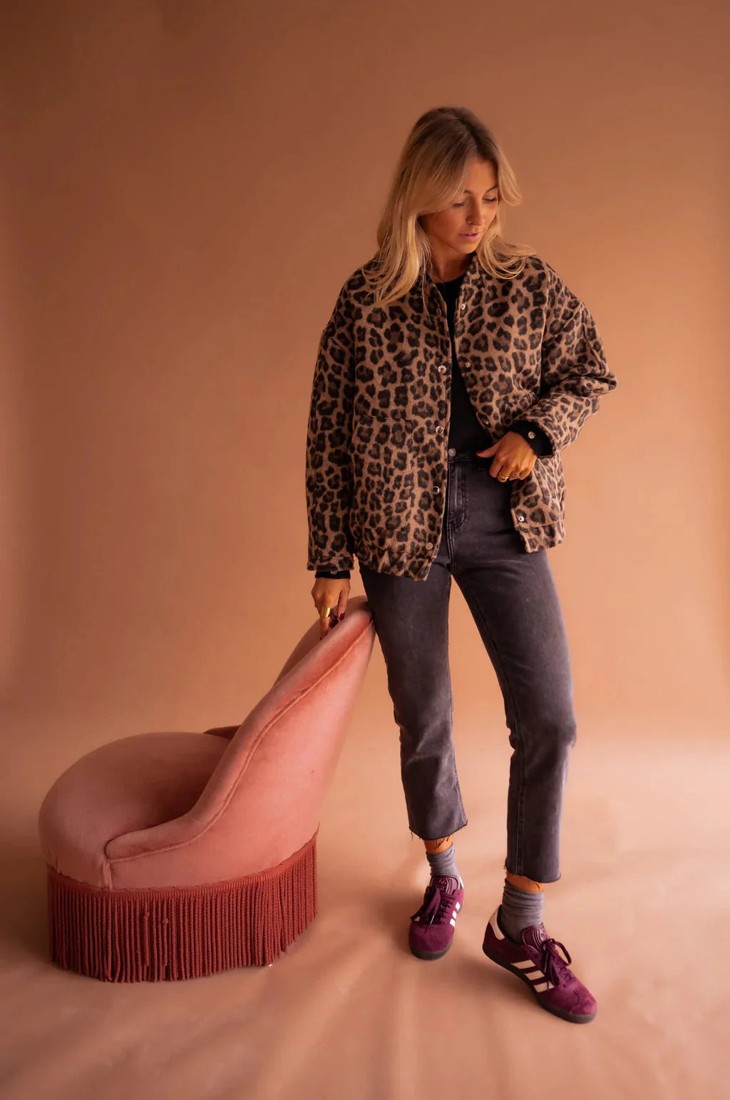 Full length view of the leopard print bomber jacket with jeans