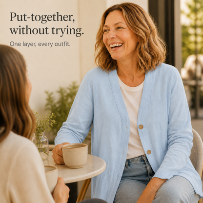 Feature panel of the light blue cardigan worn at a cafe table