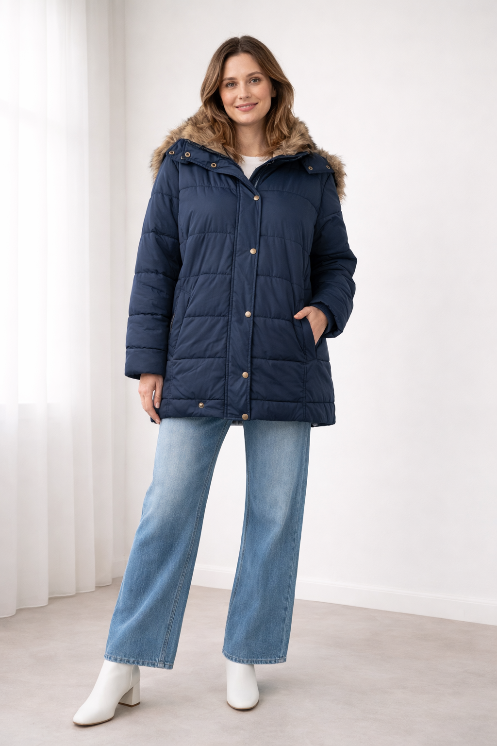 Navy quilted snap-front jacket with a faux fur trimmed hood