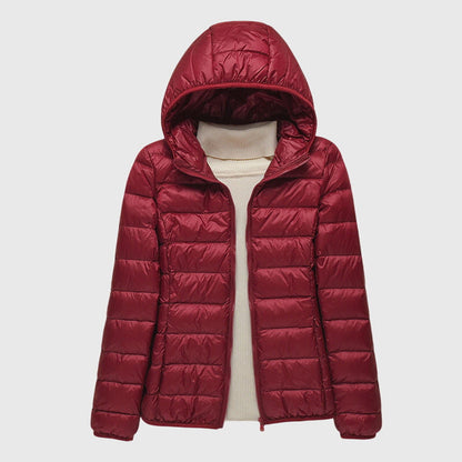 Burgundy lightweight quilted puffer jacket with a hood, flat lay