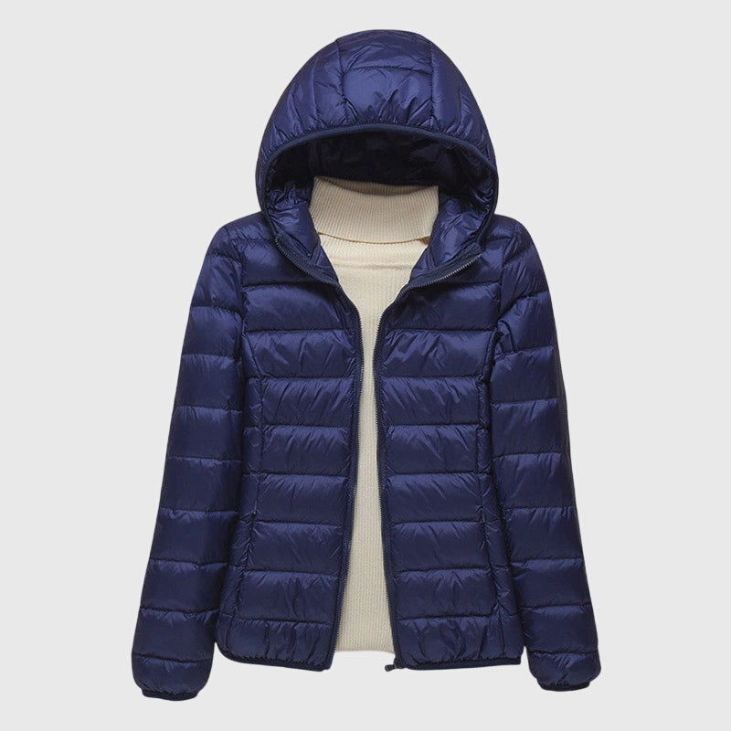 Navy lightweight quilted puffer jacket with a hood, flat lay