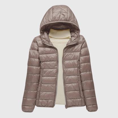 Taupe lightweight quilted puffer jacket with a hood, flat lay