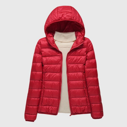 Red lightweight quilted puffer jacket with a hood, flat lay