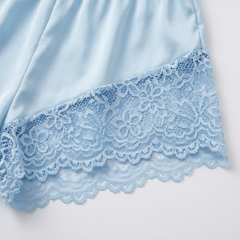 Scalloped lace hem on blue satin shorts
