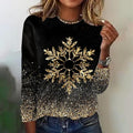 Black knit sweater with a gold sequin snowflake and glitter hem