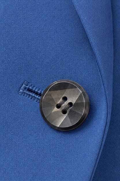 Dark horn button and buttonhole on a blue blazer