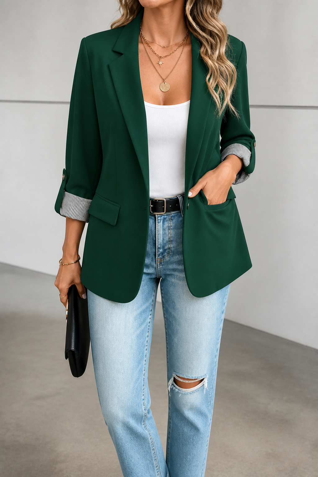 Dark green blazer with roll sleeves and striped cuffs