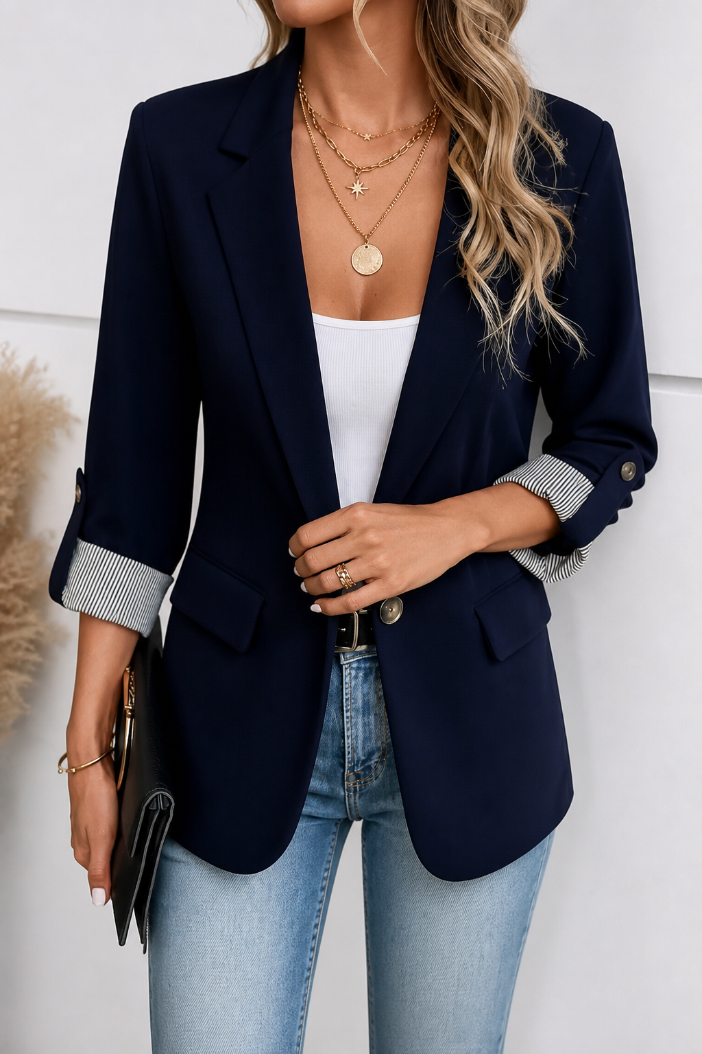 Navy blazer with roll sleeves and striped contrast cuffs