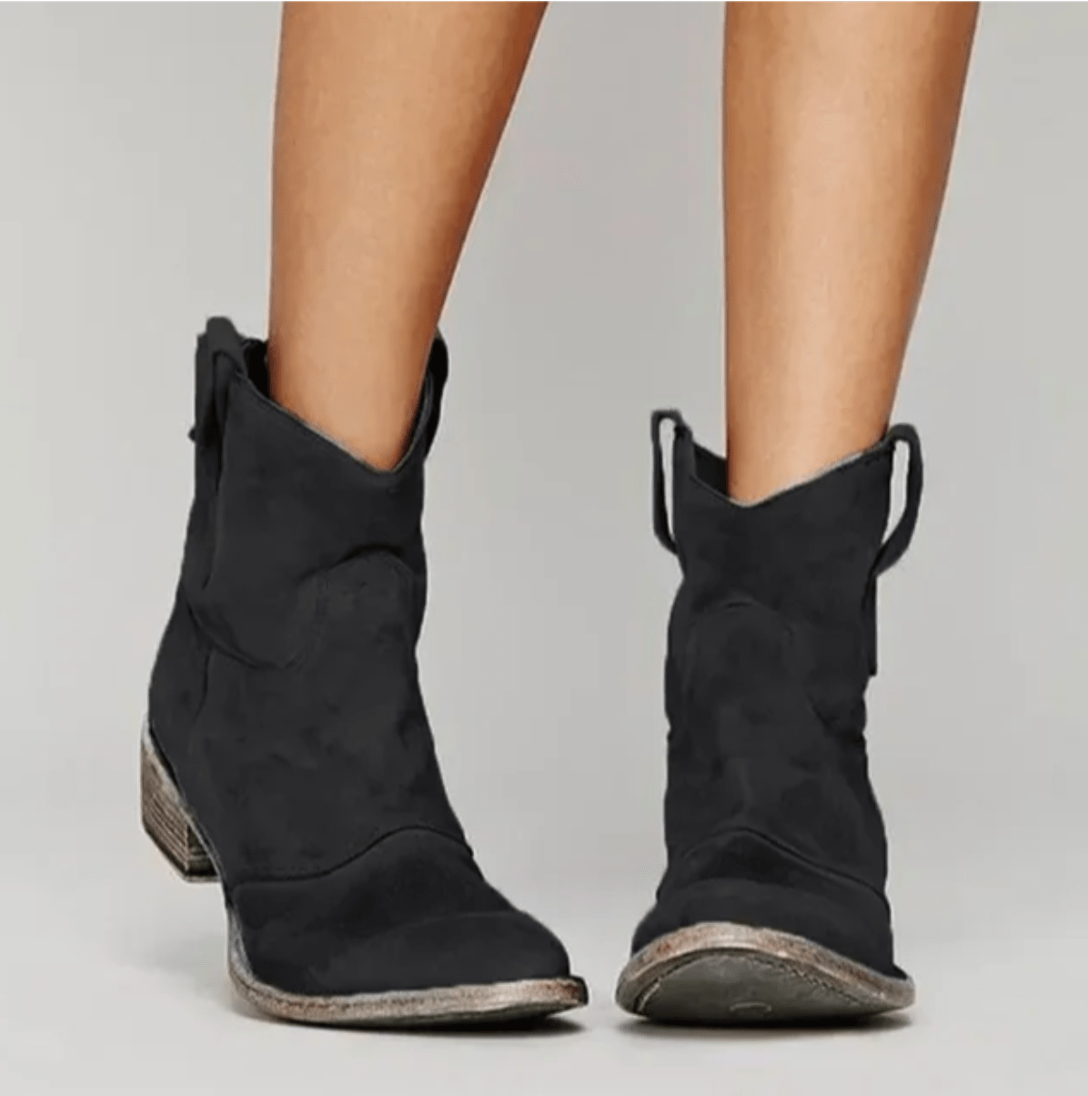 Black suede ankle boots with a block heel and pull tab