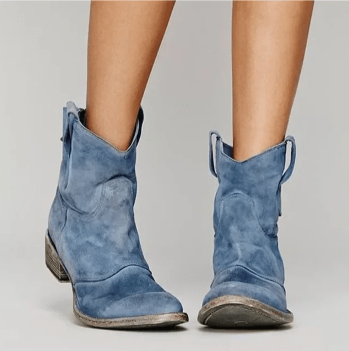 Blue suede ankle boots with a block heel and pull tab