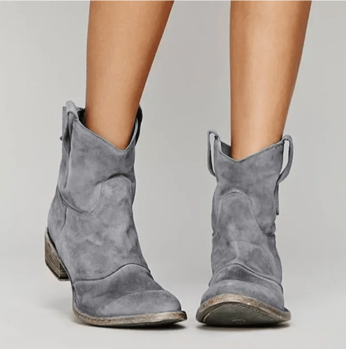 Grey suede ankle boots with a block heel and pull tab