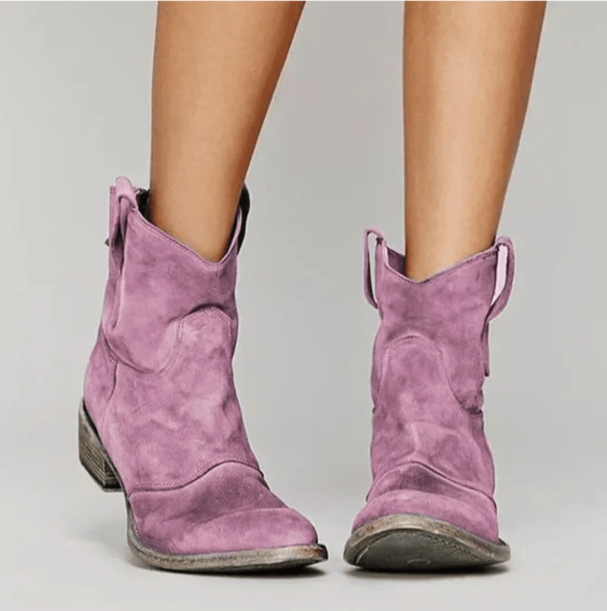 Pink suede ankle boots with a block heel and pull tab