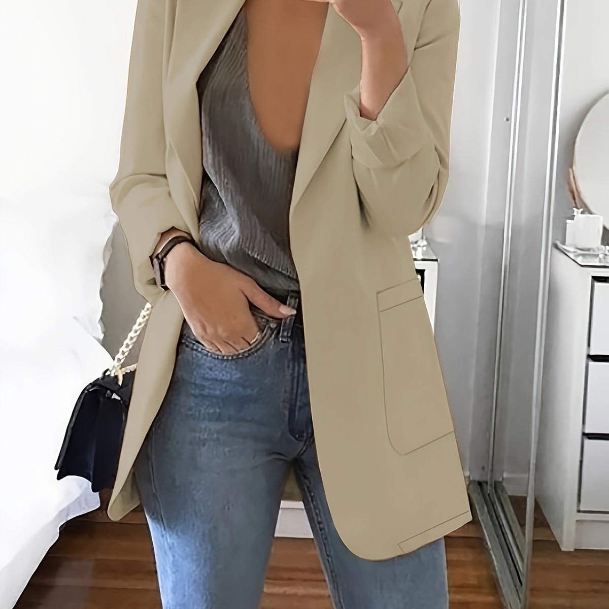 Khaki tailored longline blazer worn open over jeans