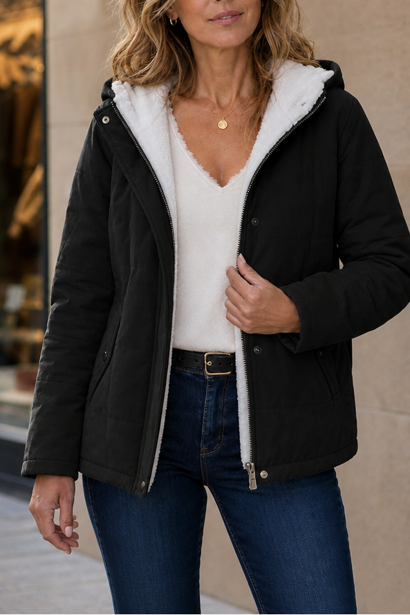 Black hooded puffer jacket with a cream sherpa lining