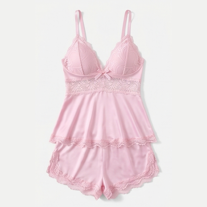 Pink lace peplum cami and shorts set laid flat