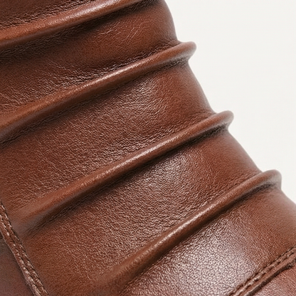 Close up of the ruched leather shaft on a brown ankle boot