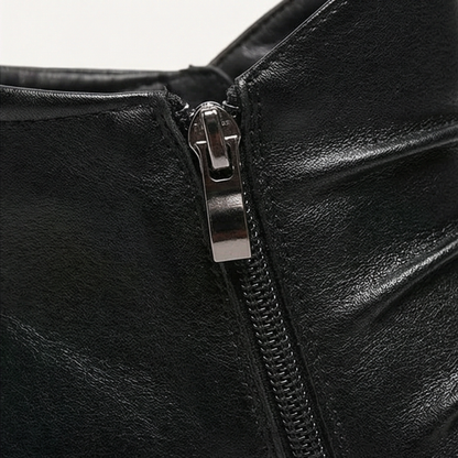 Side zip detail on a black ruched ankle boot