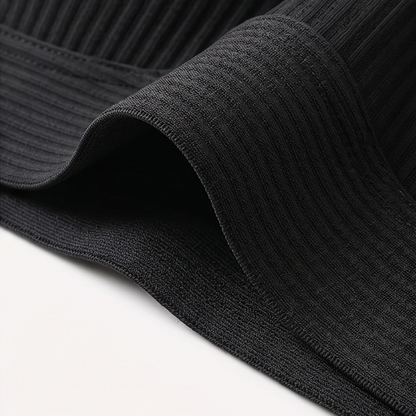 Folded black ribbed bra band showing its edge