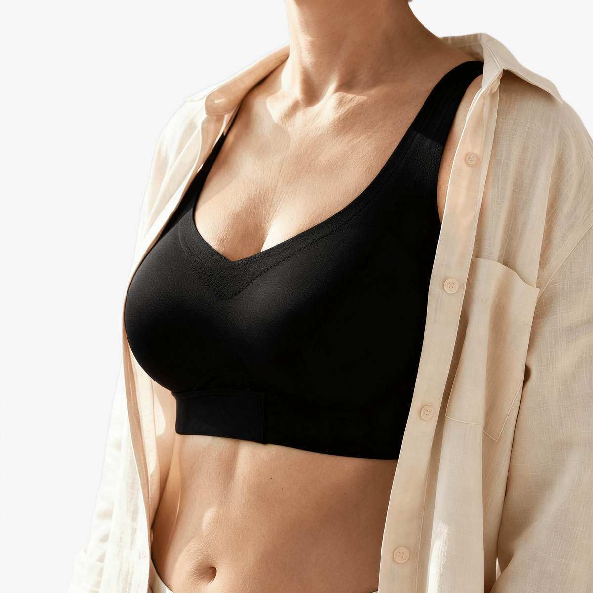 Black cotton-lined bra worn under an open linen shirt